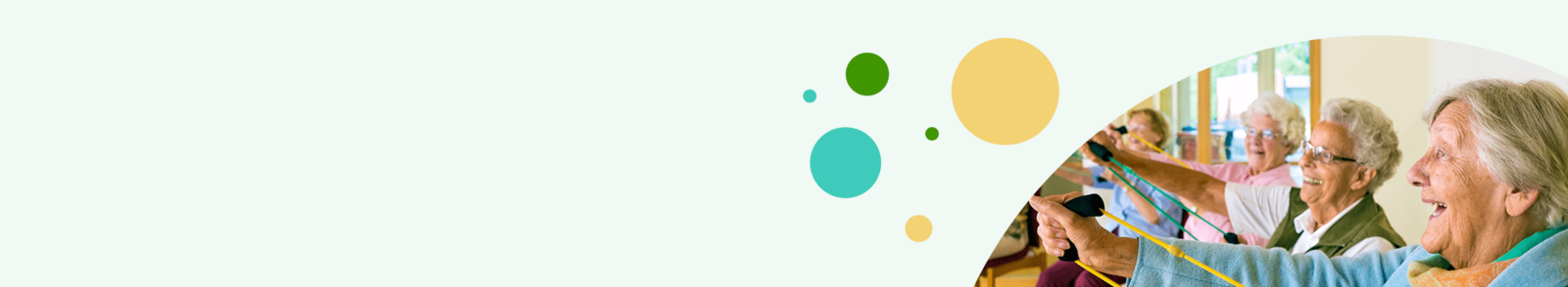 Gruppe älterer Menschen sitzt nebeneinander und streckt die Arme nach vorne aus, im Hintergrund bunte Kreise.